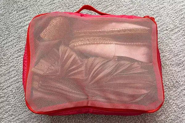 A close-up of a filled Cram Packing Cube