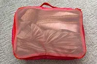 A close-up of a filled Cram Packing Cube