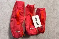 The Cram Packing Cubes with tags standing on a floor