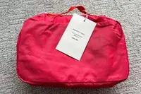 The back of a Cram Packing Cube with tags