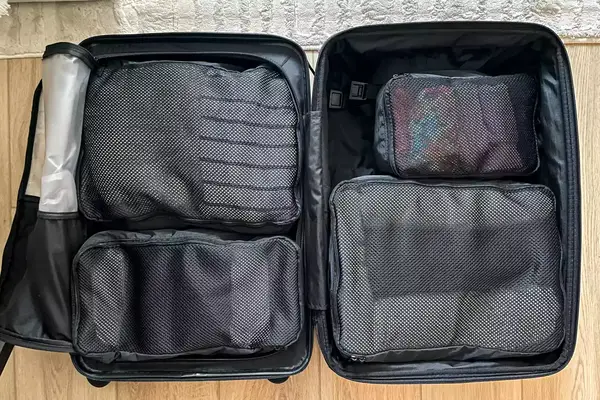 The July Packing Cells packed in a suitcase