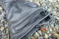 A close-up of the zipper on the Gerbing 7V Hard Knuckle Battery Heated Gloves