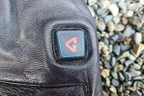 A close-up of the logo on the Gerbing 7V Hard Knuckle Battery Heated Gloves