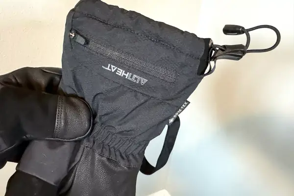 A person holds the Outdoor Research Prevail Heated GORE-TEX Gloves