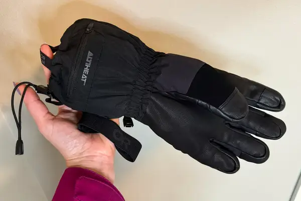 A person holds the Outdoor Research Prevail Heated GORE-TEX Glove