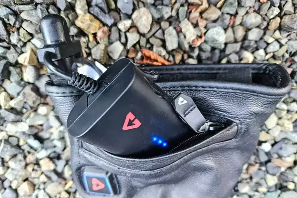 The Gerbing 7V Hard Knuckle Battery Heated Gloves while charging