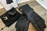 The Outdoor Research Prevail Heated GORE-TEX Gloves with accessories and box