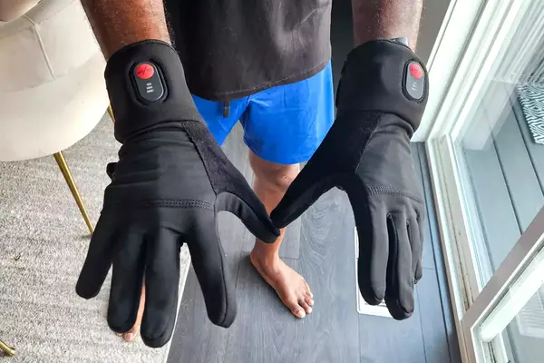 A person wears the SAVIOR HEAT Heated Glove Liners 