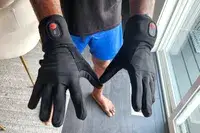 A person wears the SAVIOR HEAT Heated Glove Liners 