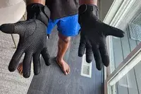 A person wears the SAVIOR HEAT Heated Glove Liners inside