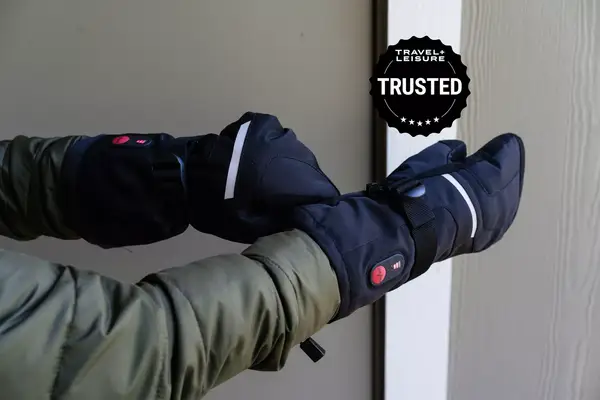 Person pulls on Snow Deer Heated Mittens