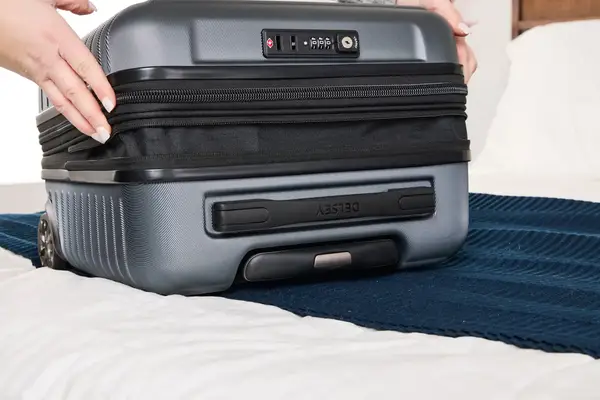 A person expands the Delsey Paris Cruise 3.0 2-Wheeled Underseater