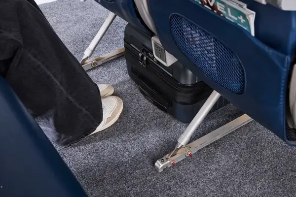 The Delsey Paris Cruise 3.0 2-Wheeled Underseater under an airplane seat