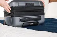 A person expands the Delsey Paris Cruise 3.0 2-Wheeled Underseater