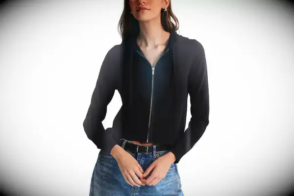 A person standing next to a body of water wearing the Portland Gear Cloudburst Hoodie