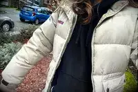 A person wearing the Gymshark Fleece Oversized Hoodie