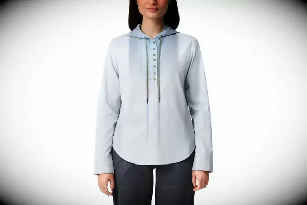 A person standing next to a body of water wearing the Portland Gear Cloudburst Hoodie