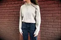 A woman wearing the Lilysilk Eshe 2-in-1 Cashmere Detachable Hoodie