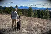 A person next to a dog wearing the Outdoor Research Women