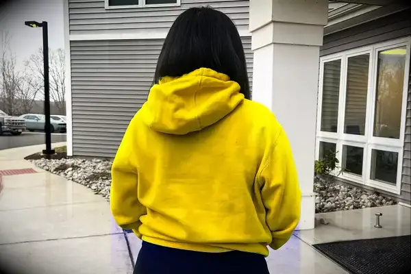 Back view of a woman wearing a Nike Sportswear Club Fleece Pullover Hoodie