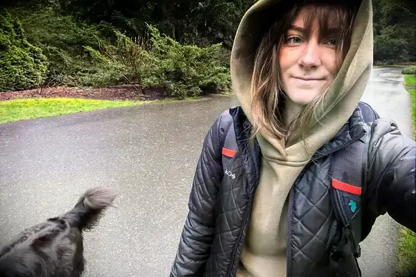 A person wearing the Portland Gear Cloudburst Hoodie while walking in the rain