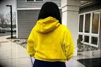 Back view of a woman wearing a Nike Sportswear Club Fleece Pullover Hoodie