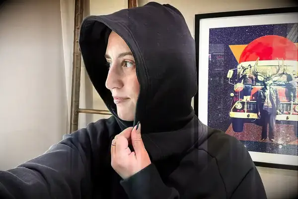 A person wearing the Athleta Easy Fleece Half Zip Hoodie