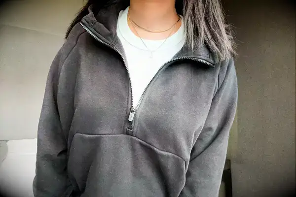 A person wearing the Athleta Easy Fleece Half Zip Hoodie