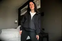 A person wearing the Athleta Easy Fleece Half Zip Hoodie