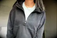 A person wearing the Athleta Easy Fleece Half Zip Hoodie