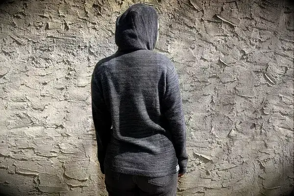 A person wearing Paka The Hoodie