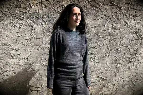 A person wearing the Paka The Hoodie