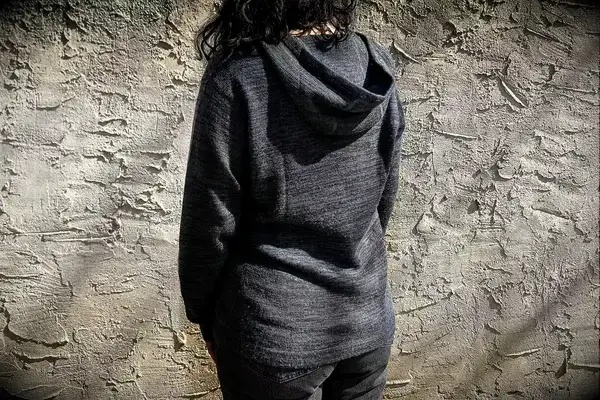 A person wearing Paka The Hoodie