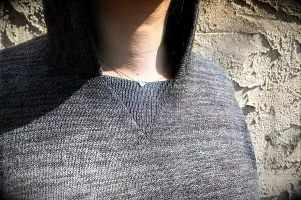 A close up of a person wearing the Paka The Hoodie