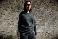 A person wearing the Paka The Hoodie