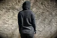 A person wearing Paka The Hoodie