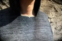 A close up of a person wearing the Paka The Hoodie