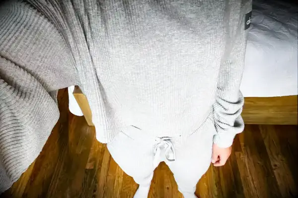 A person wearing the Alo Muse Hoodie