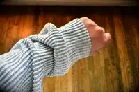 A close up of the sleeve of the Alo Muse Hoodie