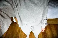 A person wearing the Alo Muse Hoodie