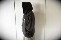 A person standing to the side wearing the Adanola ADA Oversized Hoodie