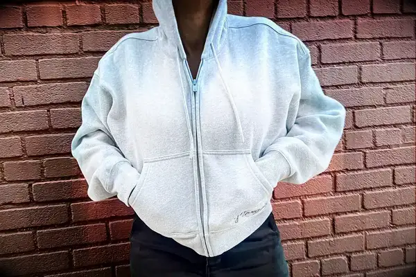 Photo of person wearing Aritzia Cozy Sweatfleece Boyfriend Boxy Zip Hoodie with hands in pockets