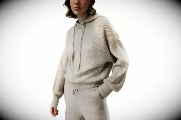 A person wearing the Portland Gear Cloudburst Hoodie while walking in the rain