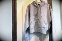 Photo of Aritzia Cozy Sweatfleece Boyfriend Boxy Zip Hoodie hanging on a hanger 