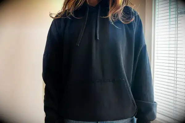 A person wearing the Gymshark Fleece Oversized Hoodie