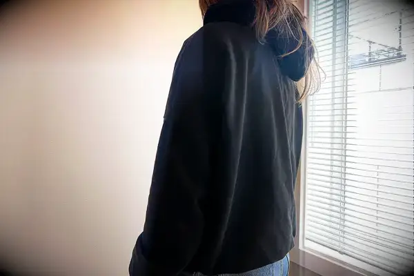 A person wearing the Gymshark Fleece Oversized Hoodie
