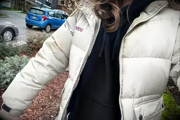 A person wearing the Gymshark Fleece Oversized Hoodie