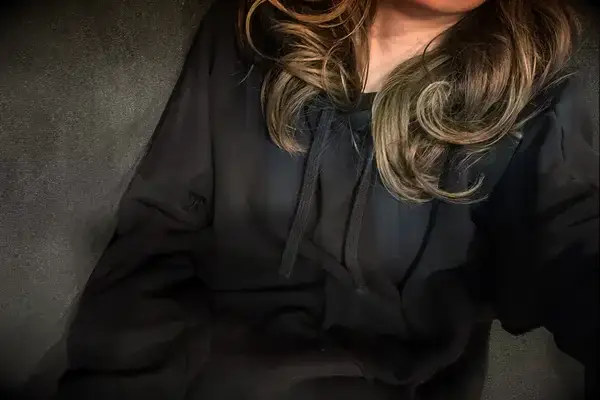 A person wearing the Gymshark Fleece Oversized Hoodie