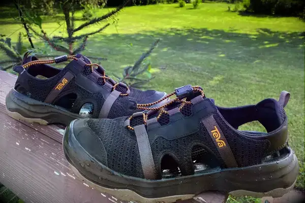 Teva Men’s Outflow CT Sandals on porch railing