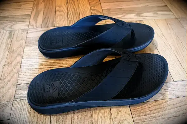 A pair of Reef The Deckhand on a wooden floor